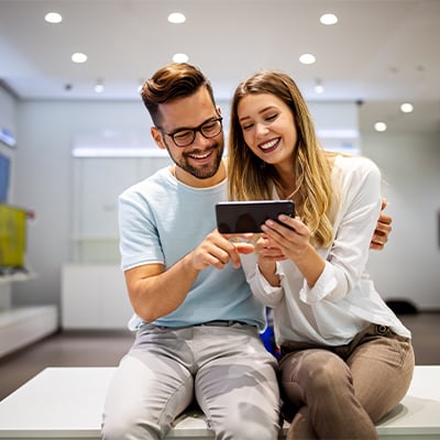 two people looking on cellphone