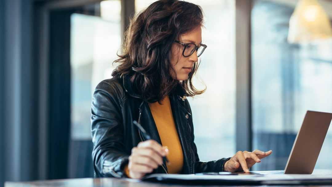 Businesswoman working at her laptop 