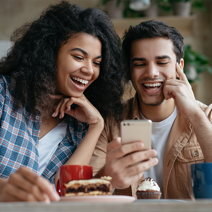 two people looking at a phone 