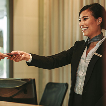 Worker handing object to someone else 