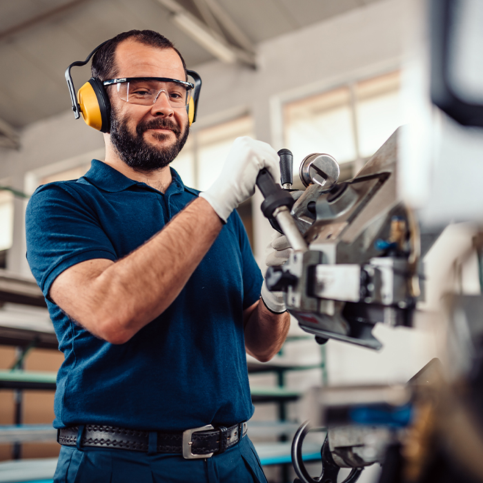 Worker operating machinery