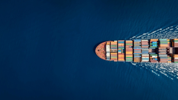 Cargo ship going across water. 