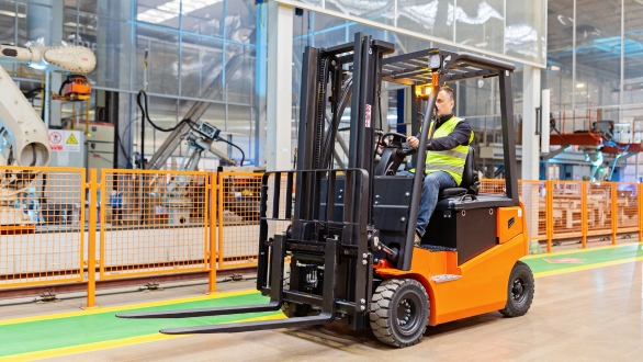 Forklift operator using a orange forklift machine.