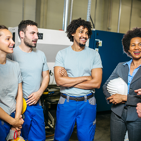 team huddle in warehouse environment